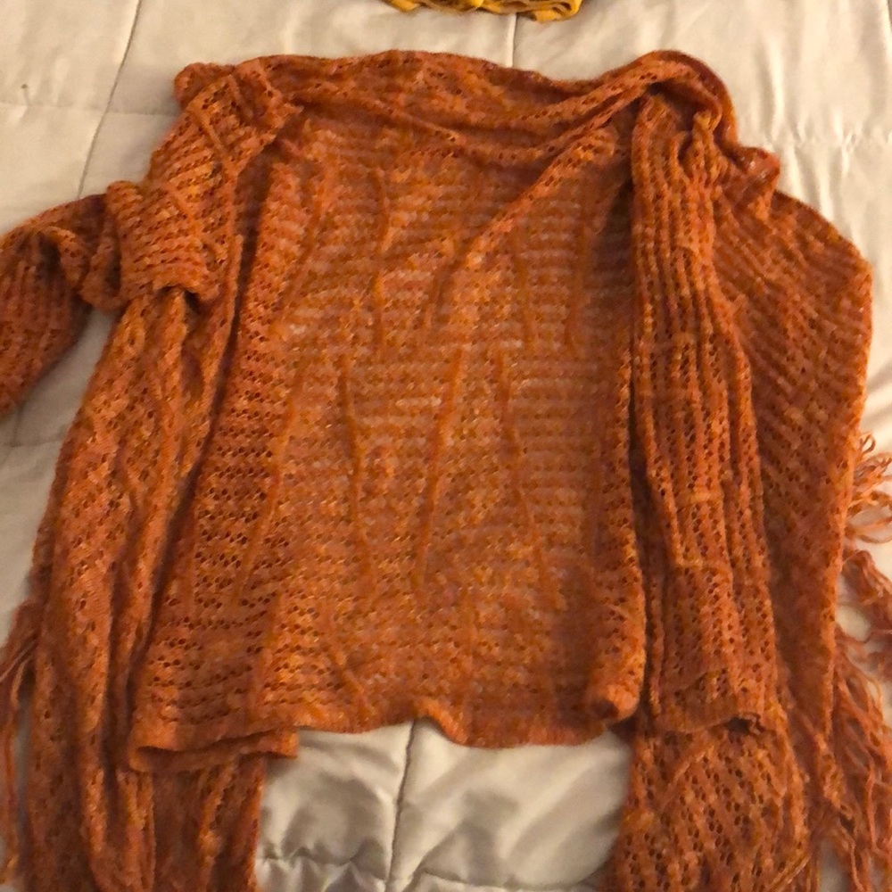 It’s orange, sweater really cute